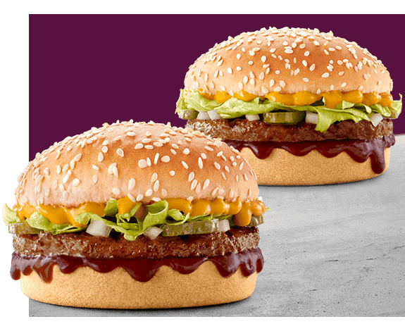 Two Wacky Wednesday burgers with beef patties, cheese, lettuce and sauce on purple background